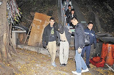 港窃贼凿穿大厦墙壁仅偷300元藏匿山洞遭围捕